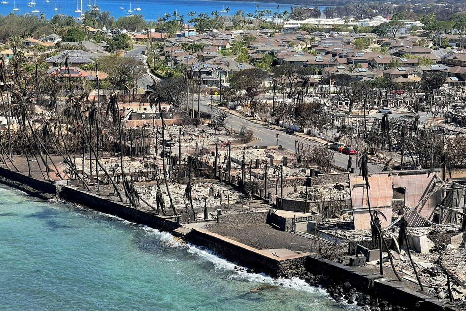 The shells of burned houses and buildings are left after wildfires driven by high winds burned across most of the town in Lahaina, Maui.
