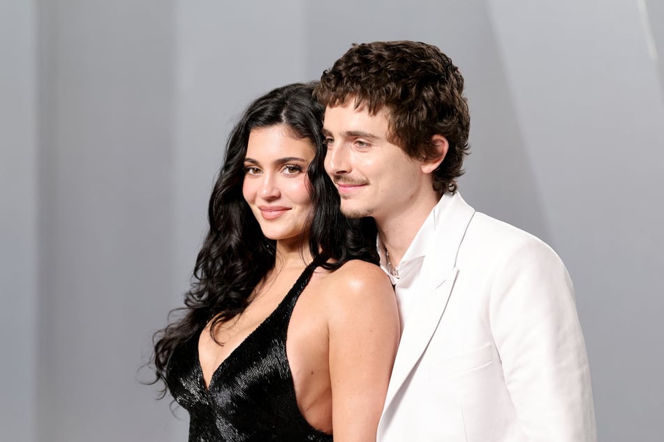 Kylie Jenner (l) is selling her longtime mansion after 10 years after teasing her plans for more kids amid her romance Timothée Chalamet (r).