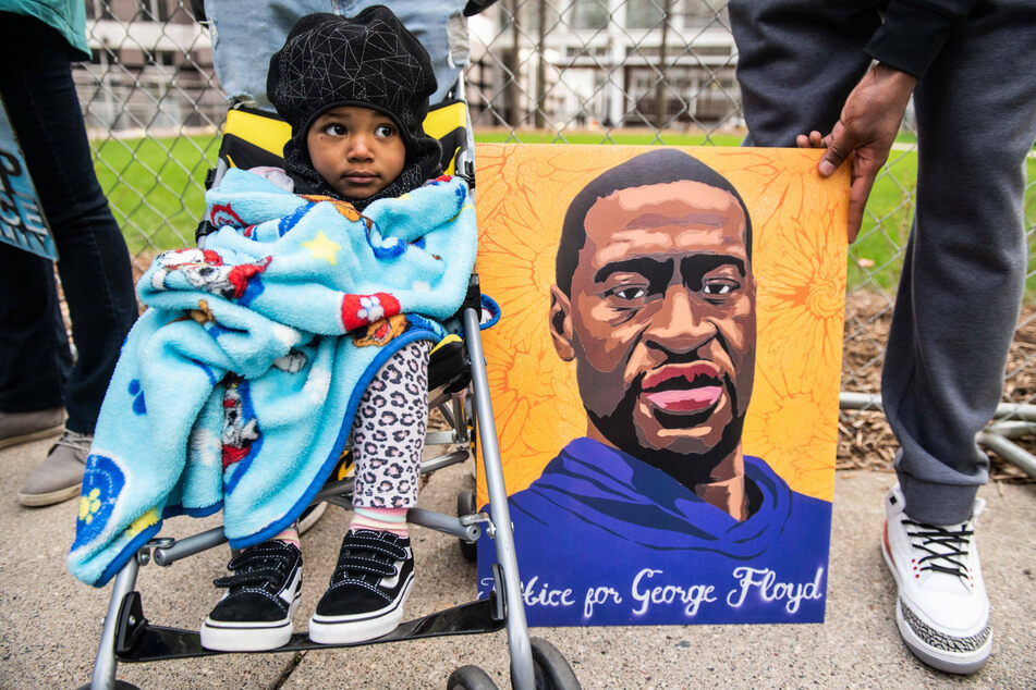 A portrait of George Floyd carried by protesters in Minnesota.