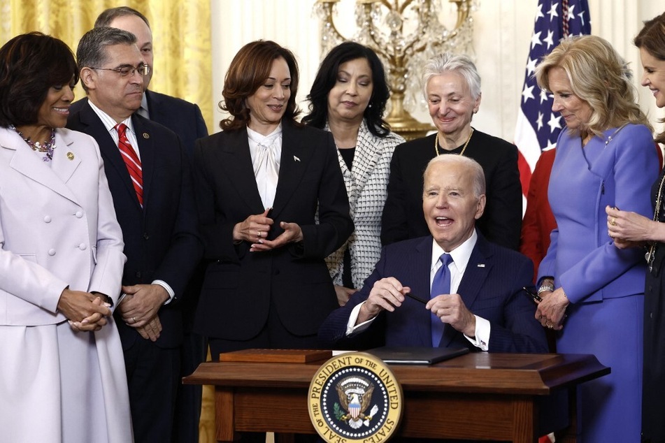 President Joe Biden signs an executive order on advancing women’s health research and innovation during a Women’s History Month reception at the White House on March 18, 2024.