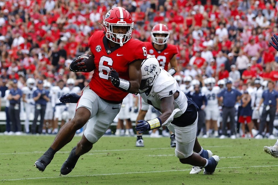 Kenny McIntosh of the Georgia Bulldogs rushes in the first half against the Samford Bulldogs at Sanford Stadium.