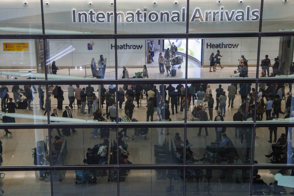 A man was arrested and charged with a suspicion of terror offense after a small trace of uranium was found in a package at London's Heathrow Airport.