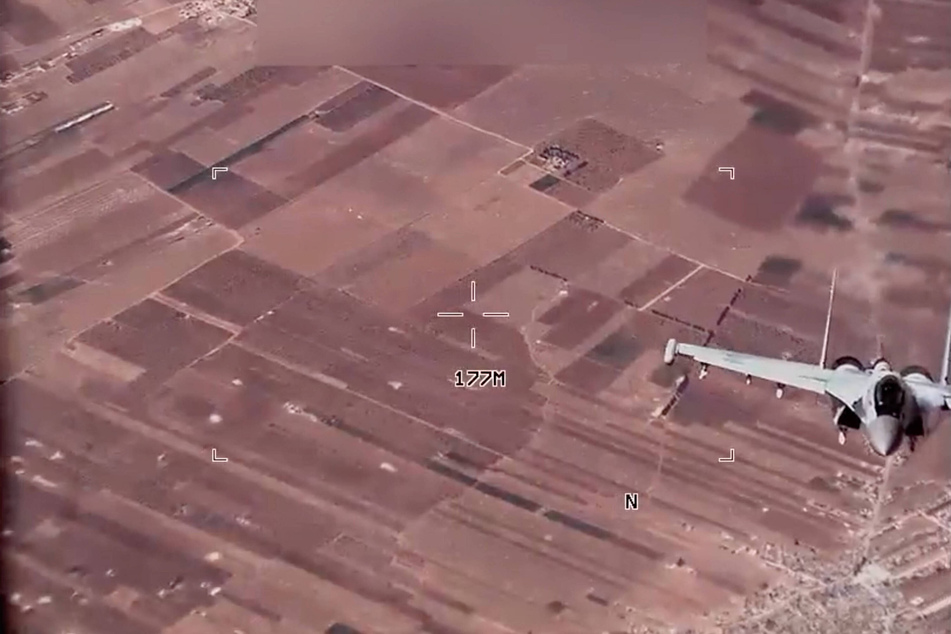 US Air Force releases footage of military drones being "harassed" by Russian jet over Syria