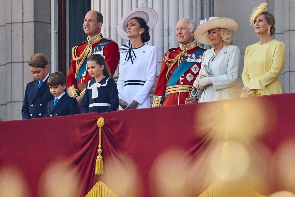 The Prince and Princess of Wales and their children join King Charles III, Queen Camilla, and Sophie, Duchess of Edinburgh, on the Buckingham Palace balcony.