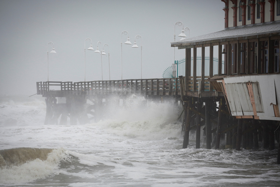 Waves crash along the Daytona Beach Main Street Pier after Hurricane Nicole made landfall on Florida's east coast.