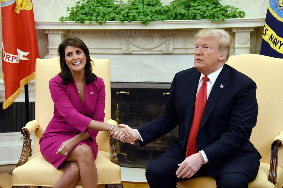Then-President Donald Trump (r.) shaking hands with Nikki Haley, his United States Ambassador to the United Nations, at the White House on October 9, 2018.