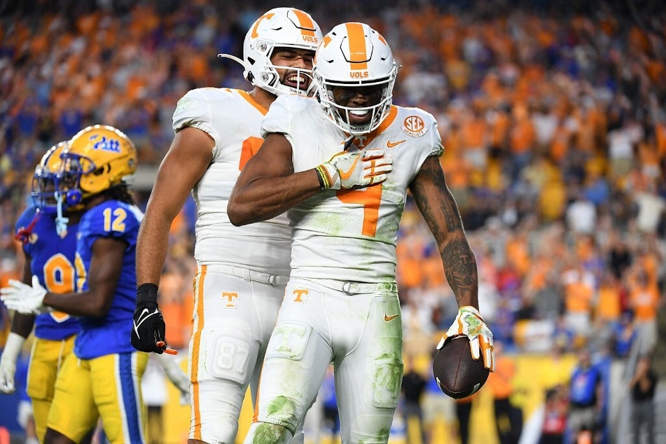 Cedric Tillman of the Tennessee Volunteers reacts after making a catch for 28-yard touchdown reception in overtime during the game against the Pittsburgh Panthers at Acrisure Stadium.