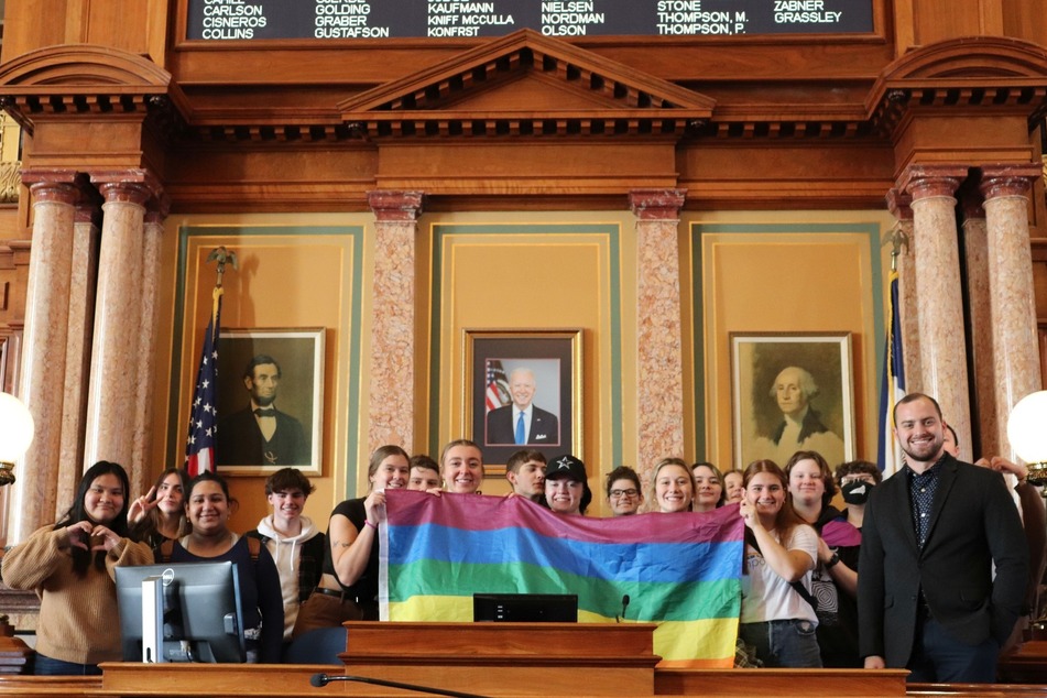 State Representative Sami Scheetz (r.) poses with students protesting for LGBTQIA+ rights at the Iowa State Capitol.