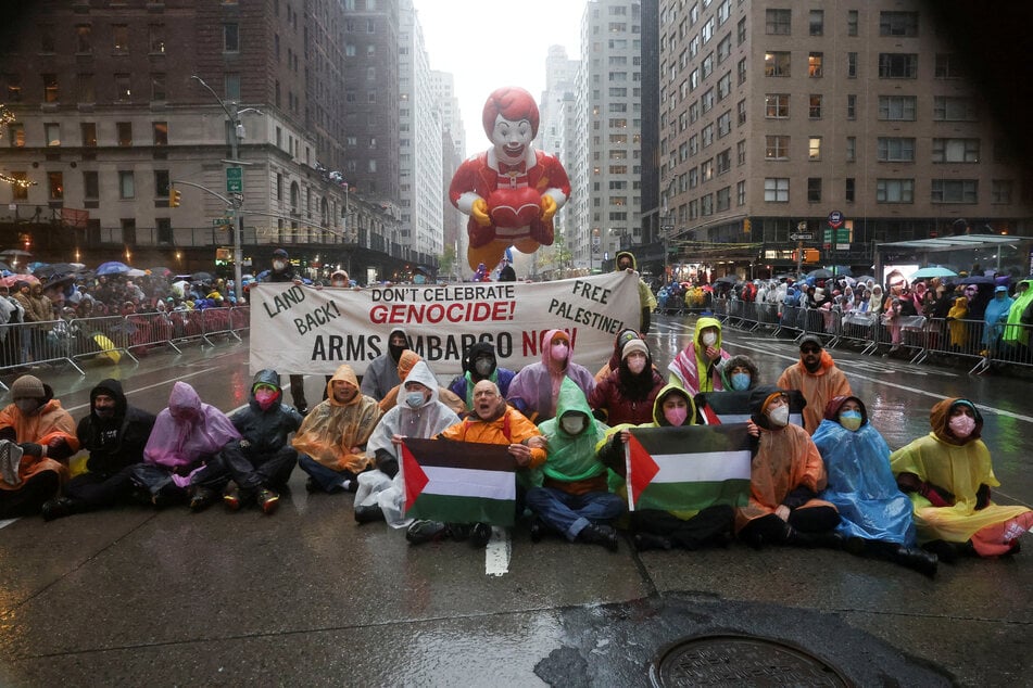 Protesters disrupt the 98th Macy's Thanksgiving Day Parade in New York City on November 28, 2024, in solidarity with the people of Palestine.