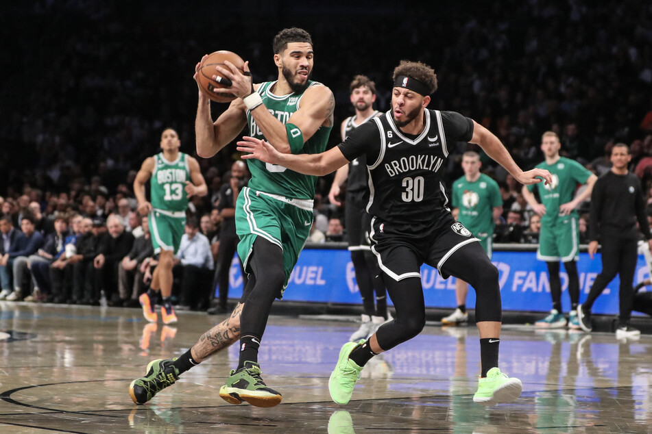 Boston Celtics forward Jayson Tatum looks to drive past Brooklyn Nets guard Seth Curry in the first quarter at Barclays Center.