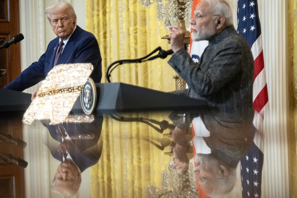 US President Donald Trump (l.) and Indian Prime Minister Narendra Modi hold a joint press conference in the East Room of the White House on February 13, 2025.