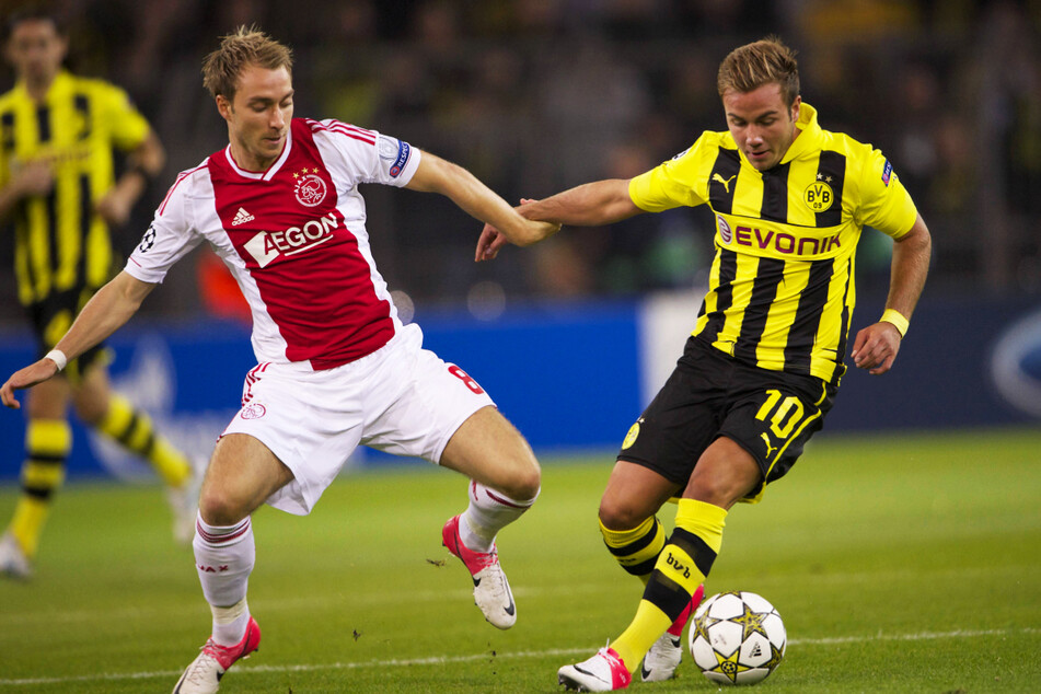 Christian Eriksen (l.) erwischte in der Saison 2012/13 mit Ajax eine echte Krachergruppe! Auch der spätere Finalist Borussia Dortmund um den WM-Siegtorschützen von 2014, Mario Götze (29), war einer der Gegner.