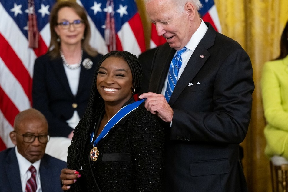 US President Joe Biden presents Gymnast Simone Biles with the Presidential Medal of Freedom, the nation's highest civilian honor.