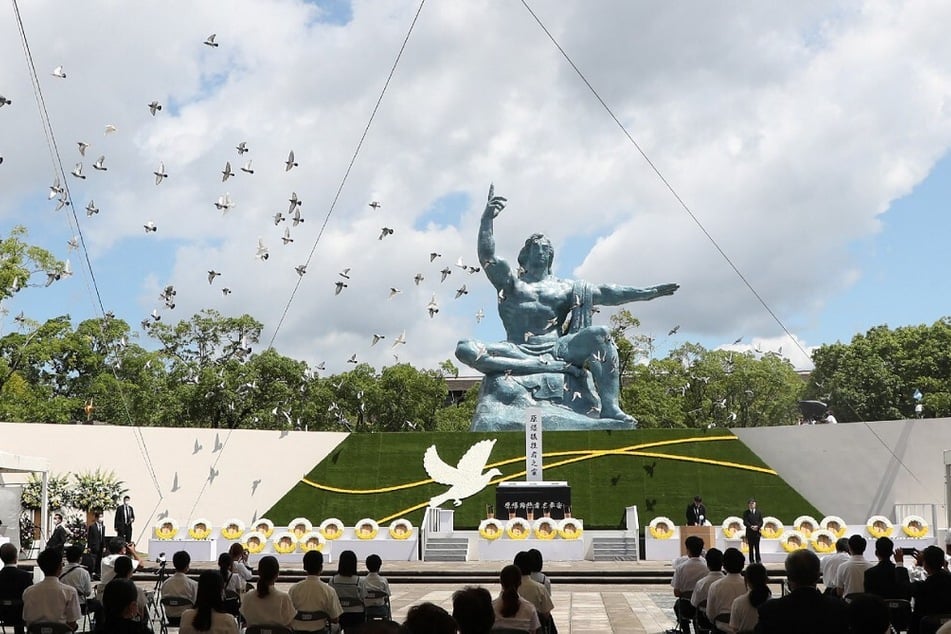 Doves fly during a memorial service for victims of the 1945 US atomic bombing at the Nagasaki Peace Park in Japan.