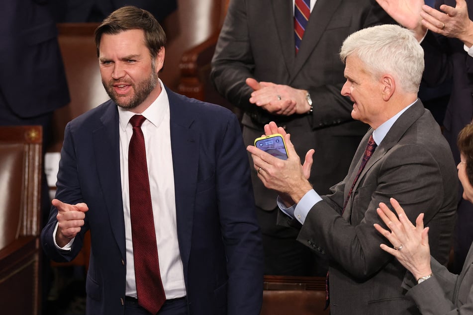 Vice President-elect JD Vance (l.) reacts after the Electoral College vote was ratified during a joint session of Congress on Monday.