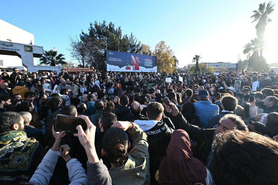 Syrian people attend a gathering to call for democracy and women's rights in Damascus' Umayyad Square on Thursday.