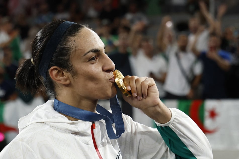 Imane Khelif of Algeria kisses her Olympic gold medal during the Victory Ceremony at Roland-Garros Stadium in Paris, France.