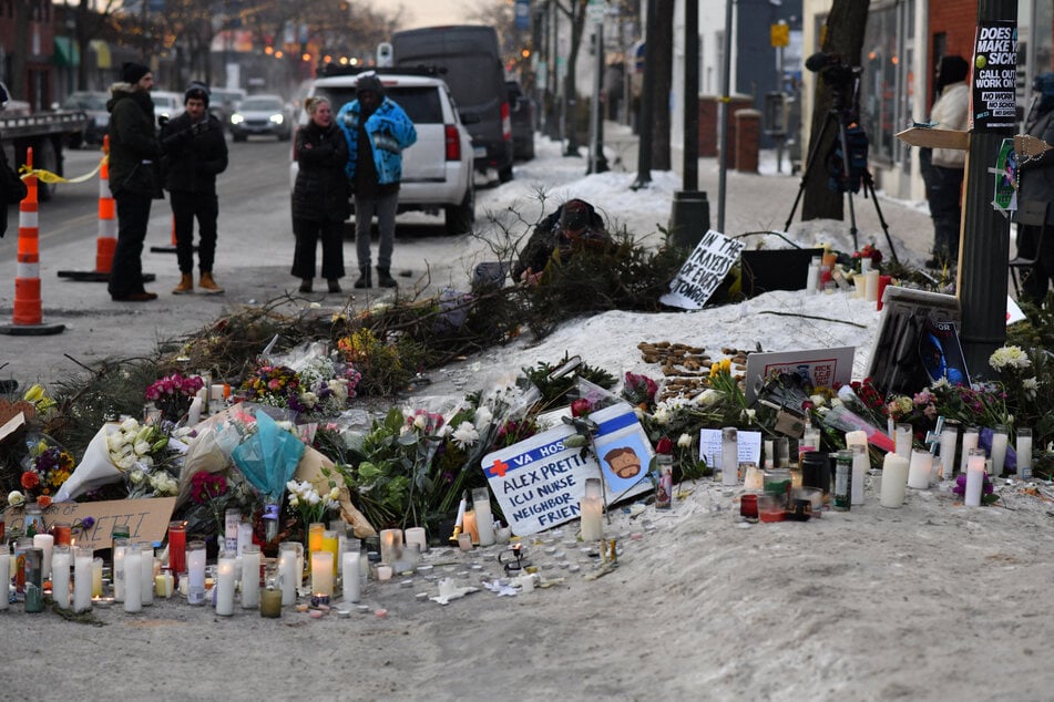 Mourners gather at a makeshift memorial in the area where Alex Pretti was shot dead a day earlier by federal immigration agents in Minneapolis, Minnesota, on Sunday.
