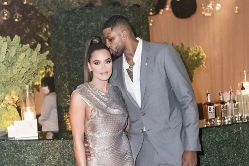 Khloé Kardashian and Tristan Thompson posing together at a party in June.