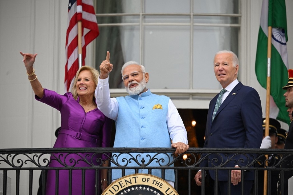 US First Lady Jill Biden, India's Prime Minister Narendra Modi, and President Joe Biden wave from the Truman Balcony at the White House on June 22, 2023.