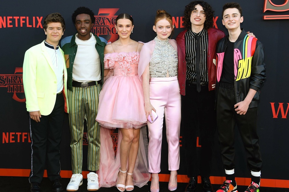 (From l. to r.) Stranger Things cast members Gaten Matarazzo, Caleb McLaughlin, Millie Bobby Brown, Sadie Sink, Finn Wolfhard, and Noah Schnapp at the season 3 premiere in Santa Monica, California.