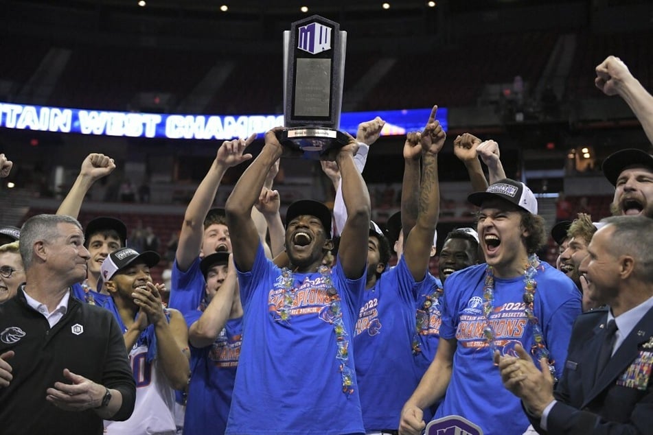 The Boise State Broncos celebrate after winning the Mountain West Conference basketball tournament.