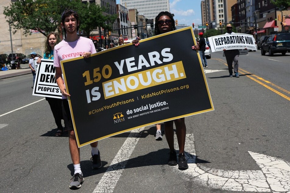 New Jerseyans march for reparations during a Juneteenth rally in Trenton.