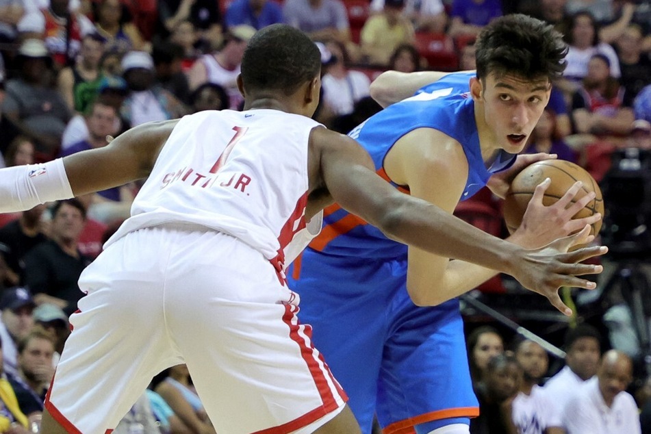 Chet Holmgren of the Oklahoma City Thunder is guarded by Jabari Smith Jr. of the Houston Rockets during the 2022 NBA Summer League game.