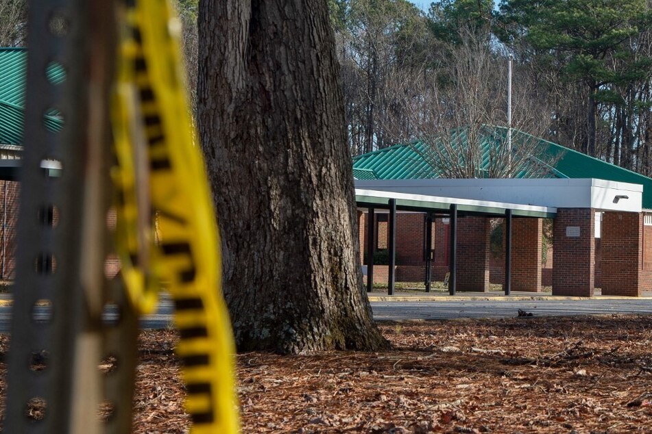 Police tape hangs from a sign post outside Richneck Elementary School following a shooting by a 6-year-old on January 7, 2023, in Newport News, Virginia.