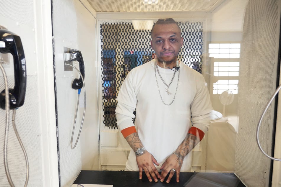 Steven Nelson sits behind glass at the Allan B. Polunsky Unit, the prison that houses men on Texas' death row, in Livingston.