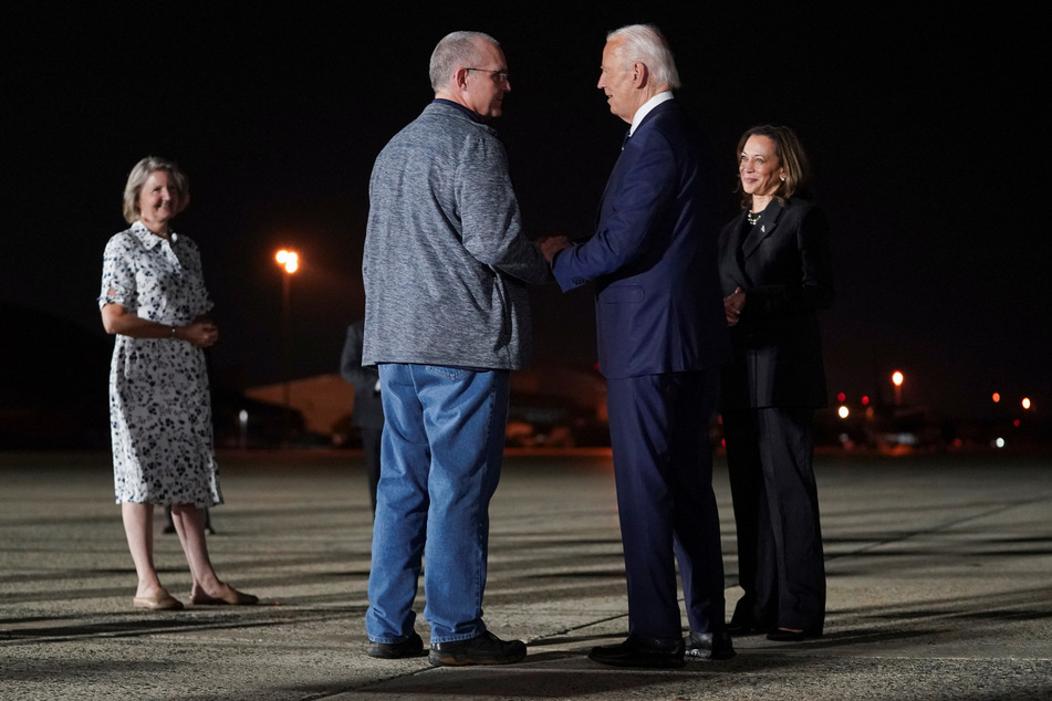 President Joe Biden and Vice President Kamala Harris greet Paul Whelan as his sister Elizabeth Whelan looks on, at Joint Base Andrews in Maryland.