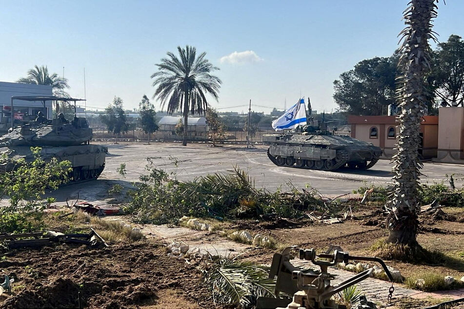 Israeli military vehicles operate in the Gazan side of the Rafah Crossing, severely limiting the entry of humanitarian aid into the besieged territory.