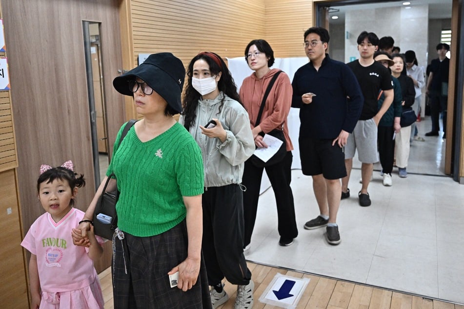 People line up to vote at a polling station during the presidential election in Seoul, South Korea, on June 3, 2025.