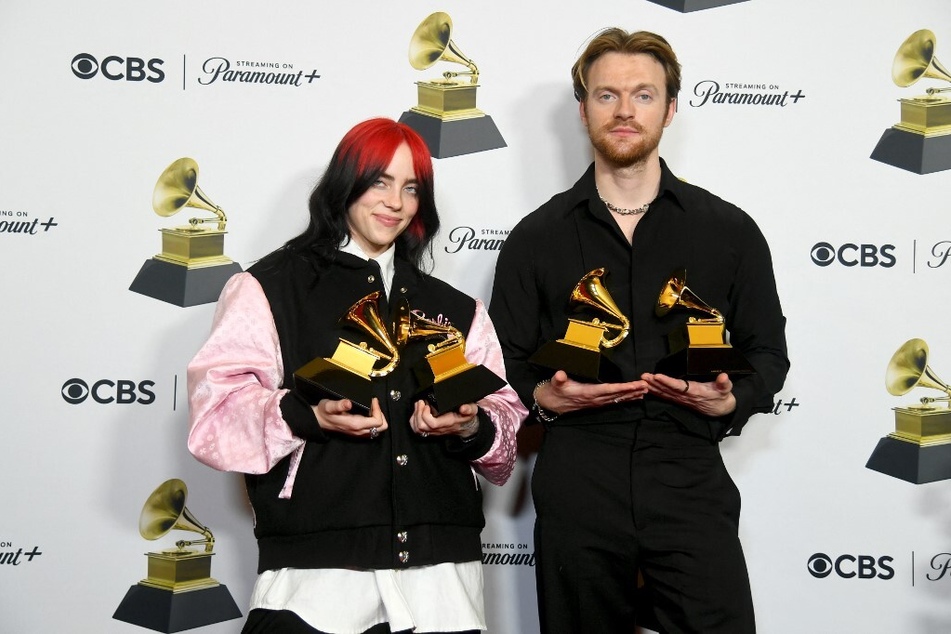 Billie Eilish and Finneas O'Connell pose in the press room during the 66th Grammy Awards.
