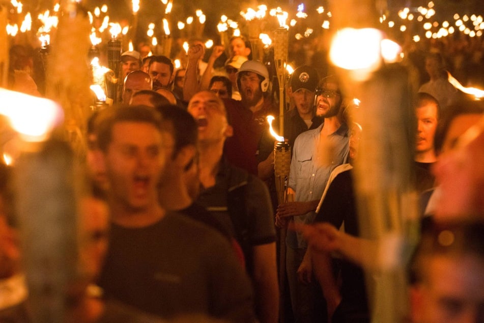 White supremacists carrying tiki torches march through the University of Virginia campus in August 2017.