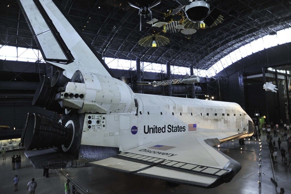 The space shuttle Discovery is seen September 3, 2012 in the James S. McDonnell Space Hangar at the National Air and Space Museum's Steven F. Udvar-Hazy Center in Chantilly, Virginia.