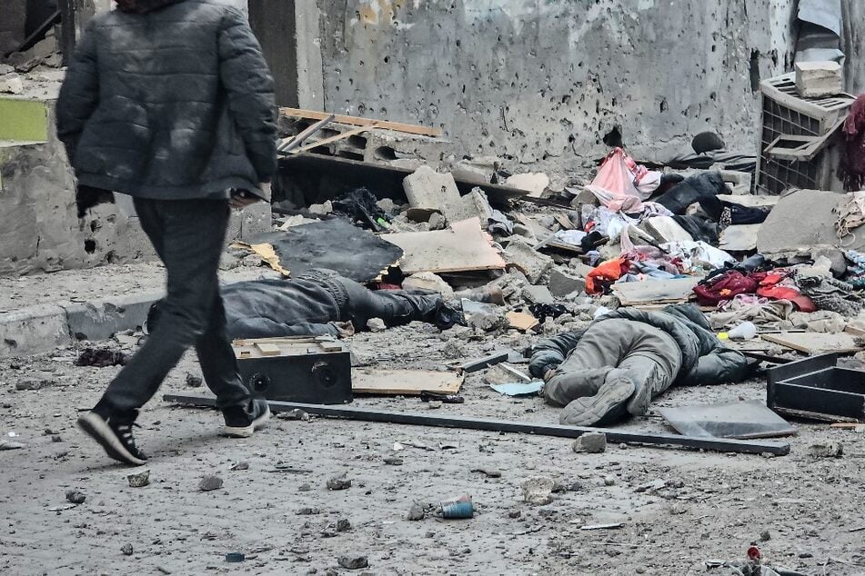 The bodies of victims lie amid the rubble in the courtyard of the Kamal Adwan hospital in Beit Lahia in the northern Gaza Strip, following Israeli strikes around the medical complex on December 6, 2024.