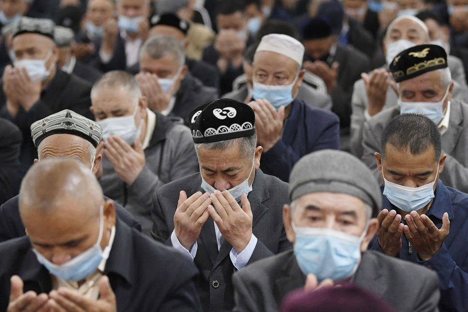 Uyghurs pray at a mosque in Urumqi in China's Xinjiang autonomous region on May 13, 2021.