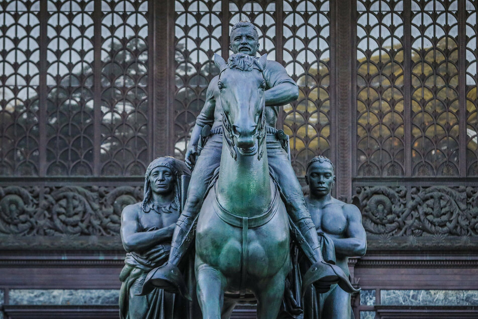 The controversial statue of Theodore Roosevelt, astride a horse and towering over a Native American and an African American.