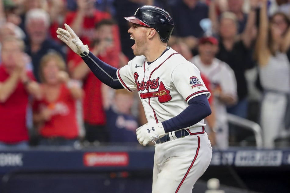 Freddie Freeman celebrates his game-winning solo home run in game four on Tuesday.