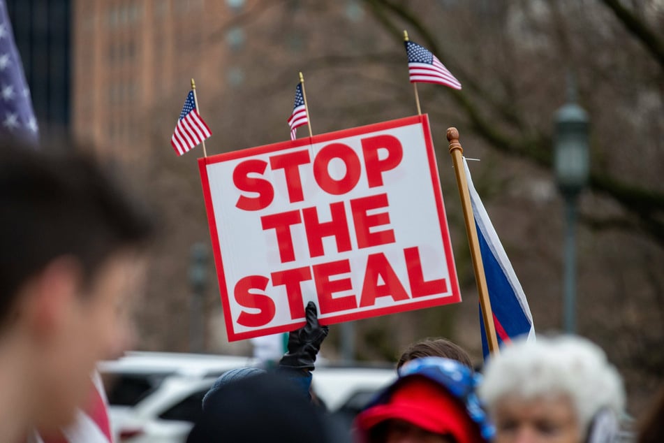 A protester holds a stop the steal placard during a pro-Trump demonstration in Pennsylvania on January 5.