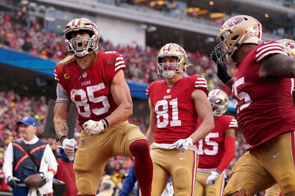 San Francisco 49ers tight end George Kittle (l.) celebrates during his team's win over the Seattle Seahawks.