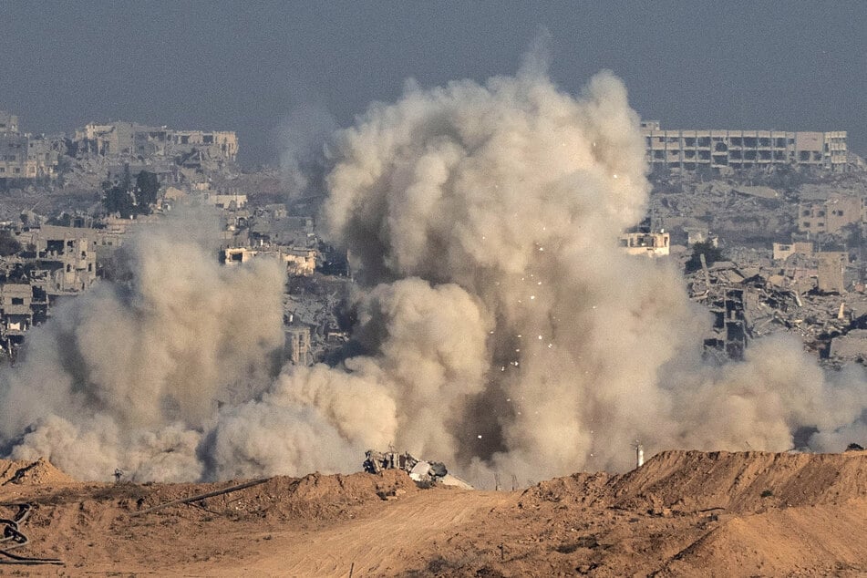This picture, taken from a position near Israel's border with the Gaza Strip, shows smoke and debris billowing during an Israeli strike on the besieged territory on Sunday.