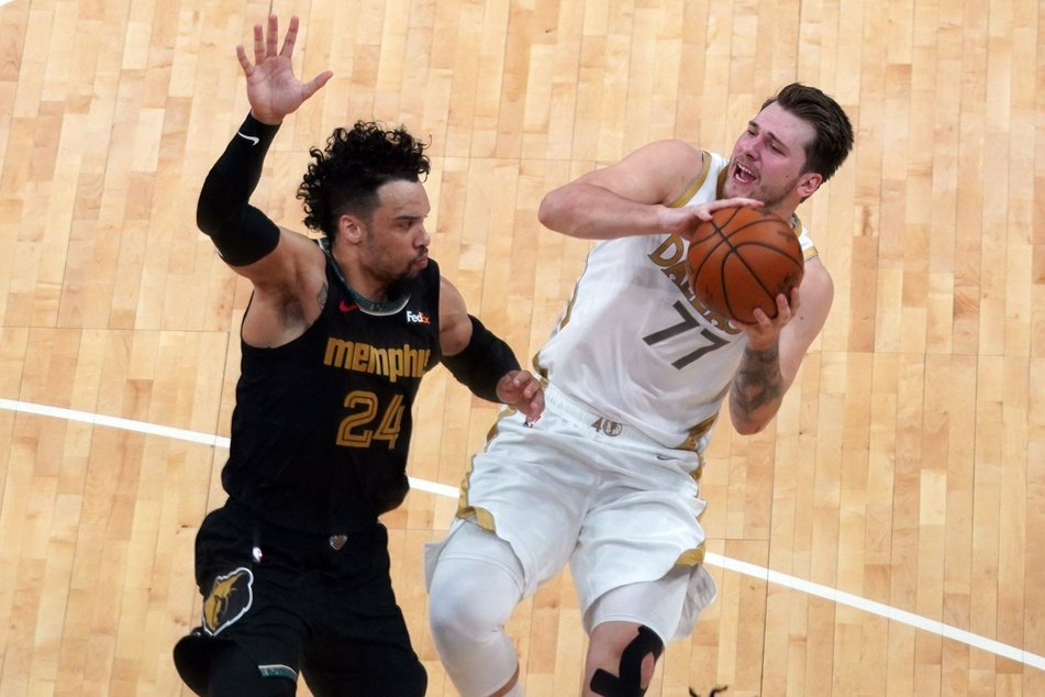 Dallas Mavericks Luka Doncic tries to shoot past Memphis Grizzlies Dillon Brooks