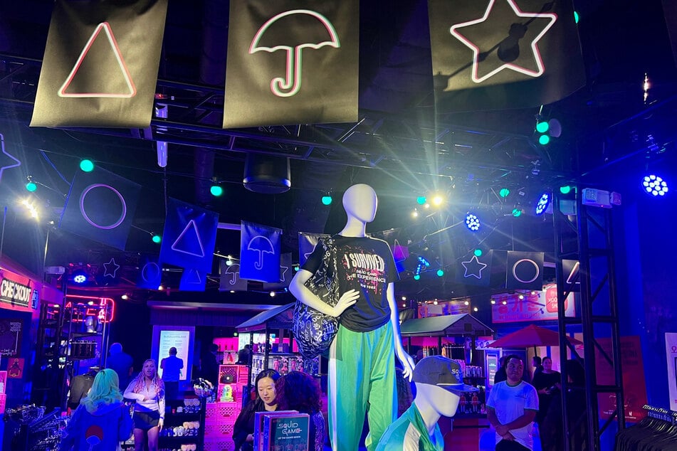 The all-ages gameplay at Squid Game: The Experience lasts for an hour, but you can explore the elaborately themed Night Market full of food, specialty soju-infused cocktails, well-designed Squid Game merch, and photo stations before and after your visit.