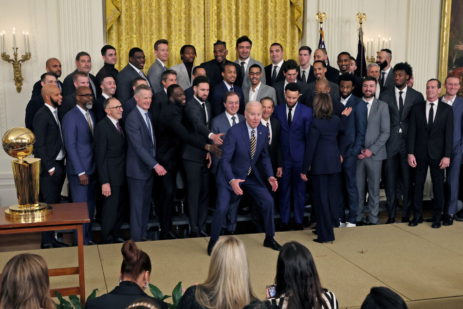 President Joe Biden poses with the Golden State Warriors team.