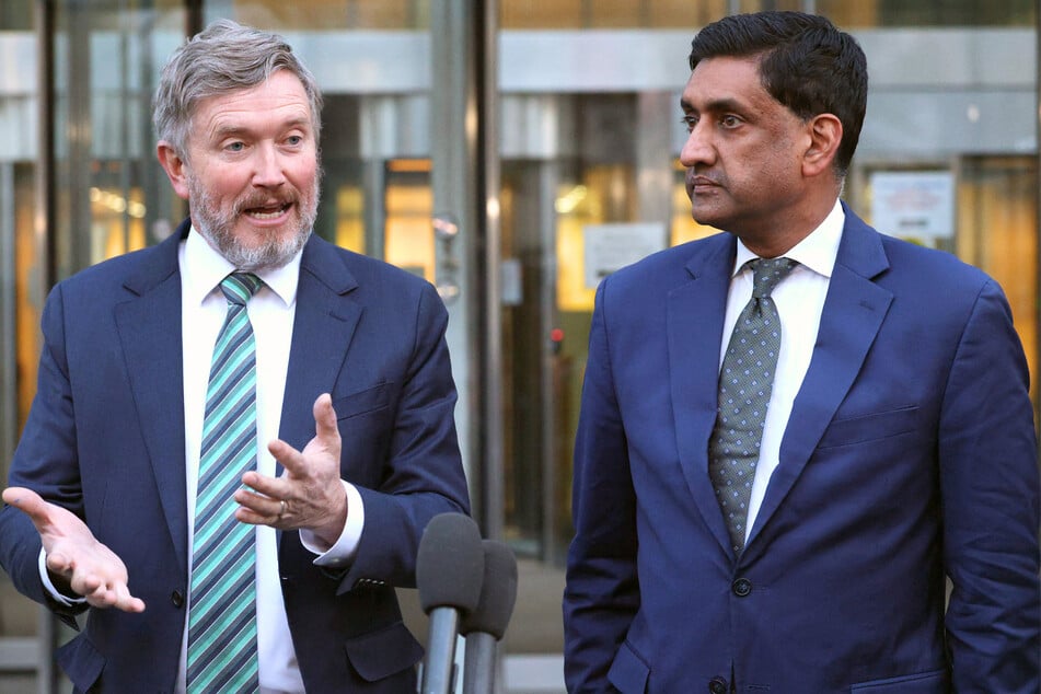 Representatives Thomas Massie (l.) and Ro Khanna speak with reporters about the Epstein files outside the offices of the Department of Justice on February 9, 2026.