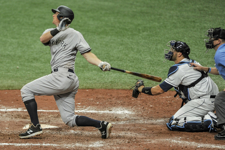 DJ LeMahieu of the NY Yankees (L) and Tampa Bay Rays catcher Mike Zunino (R)