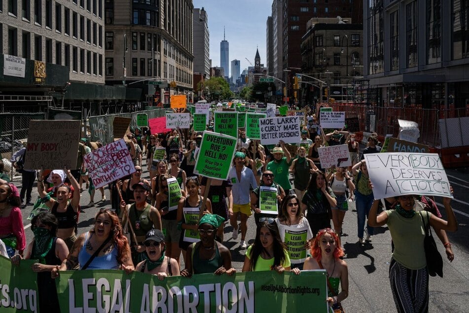 Reproductive rights activists march in New York City on July 4th to protest a recent Supreme Court decision to overturn Roe v. Wade.