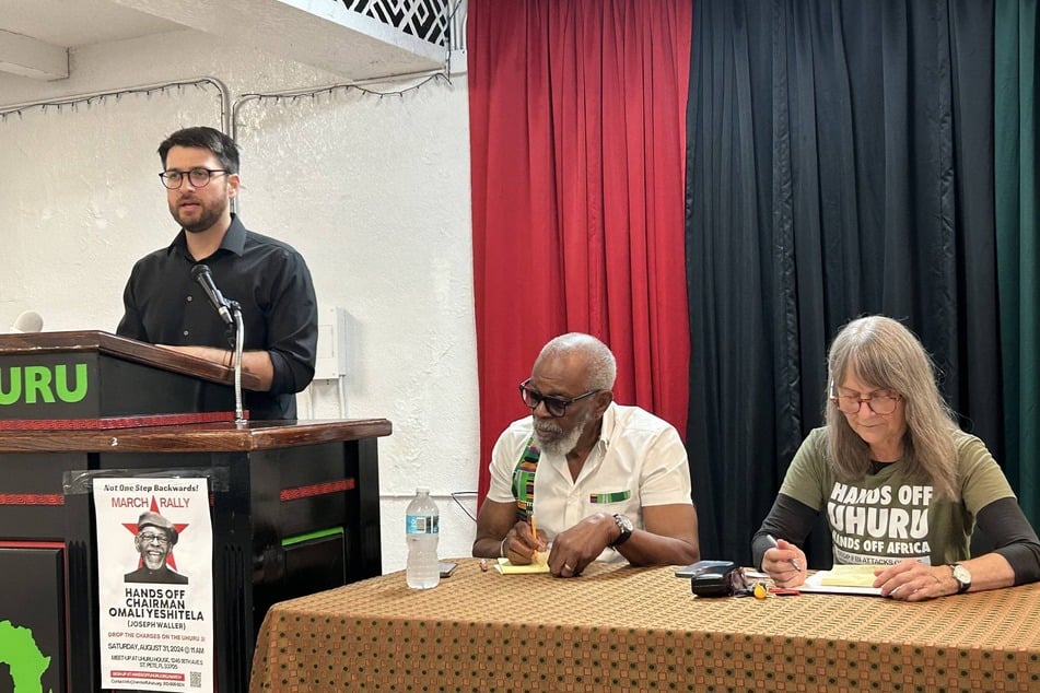 From l. to r.: Jesse Nevel, Chairman Omali Yeshitela, and Penny Hess each face up to 15 years behind bars if convicted on charges of Russian interference.